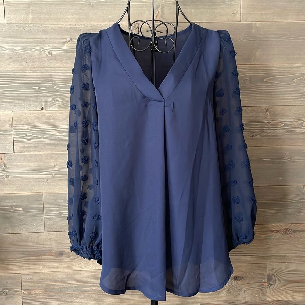 Navy V-neck, long sleeve dotted blouse